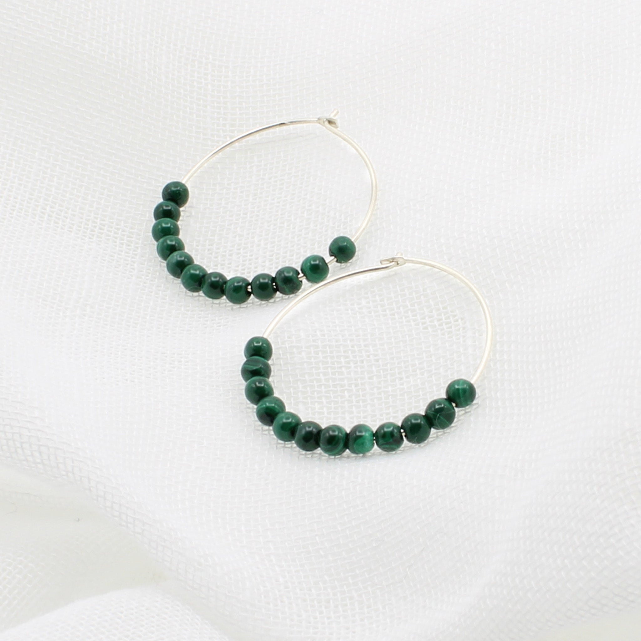 Silver hoops with malachite gemstones