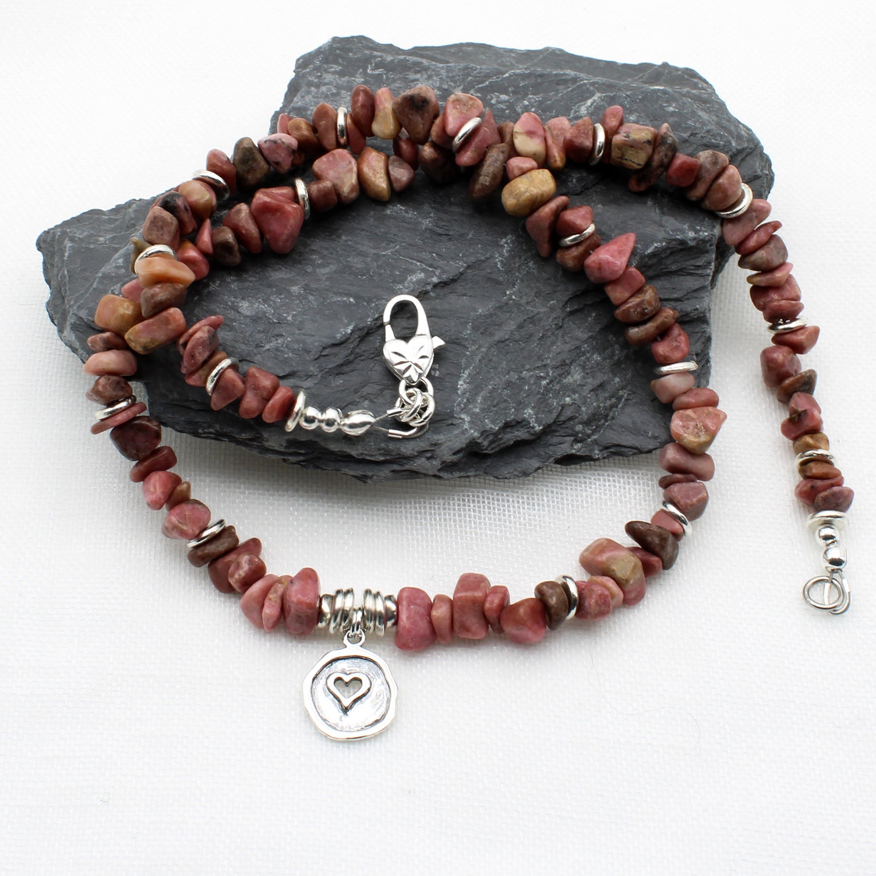 Pink Rhodonite chips with silver heart pendant and heart shaped clasp.