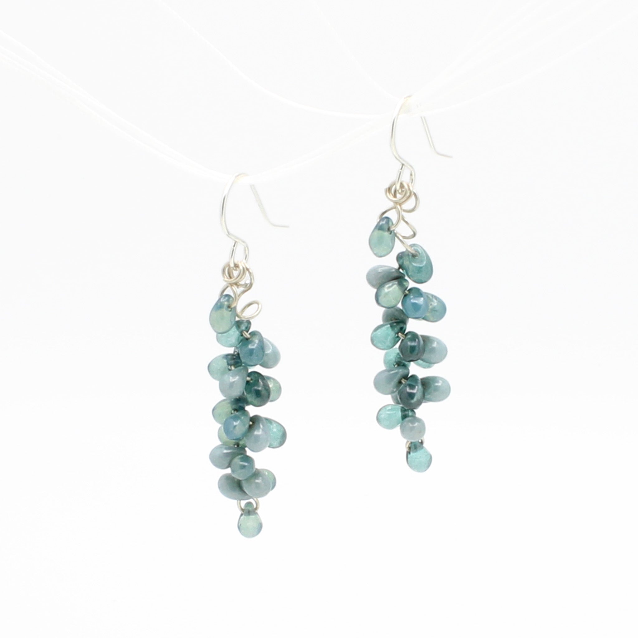 Light Blue Czech glass drops dangle on Sterling Silver earrings.